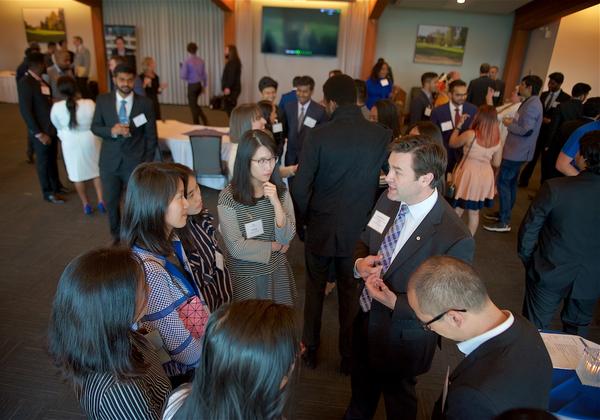 A large group of employers and students at an MBA networking event