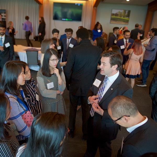 A large group of employers and students at an MBA networking event