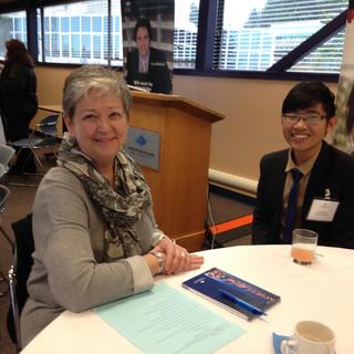 An employer and a student posing for a picture at the LMRT event