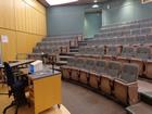 Lecture theatre looking up to seating from stage