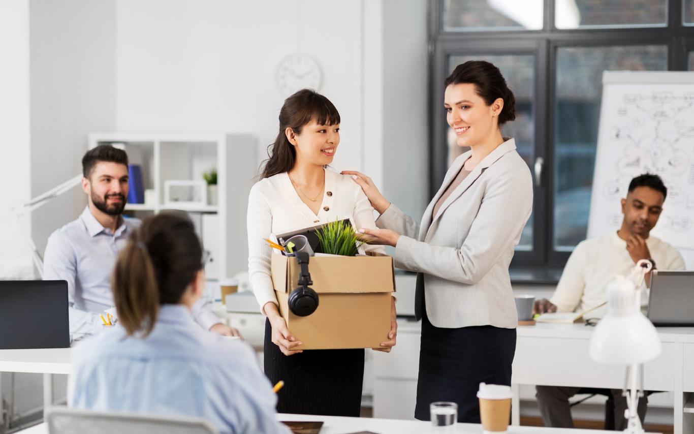 An employer welcoming the new intern and introducing her to the staff