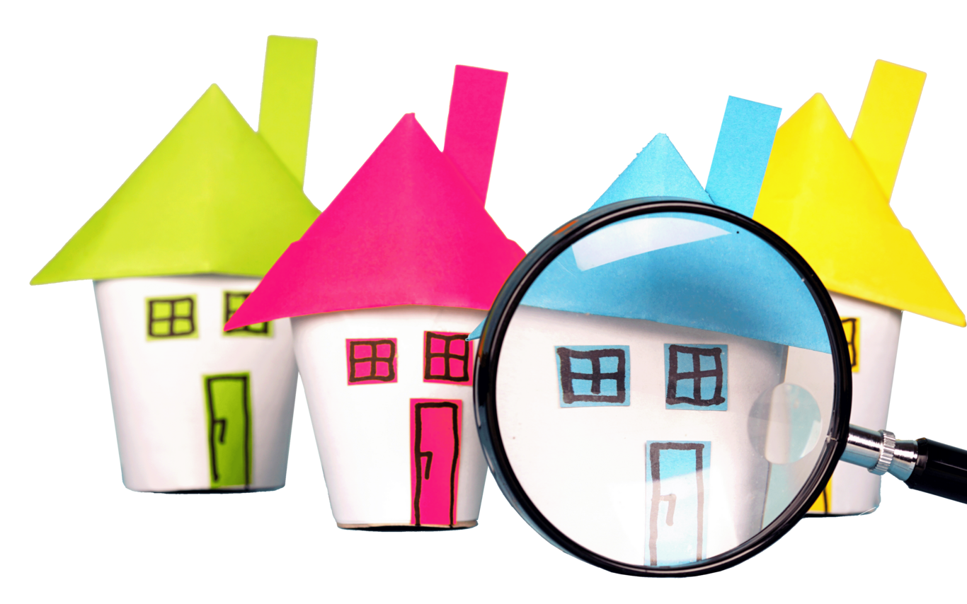 A magnifying glass in front of cartoon houses.